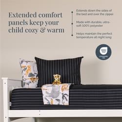 Children's bedding set with comfort panels on a bed, featuring text about comfort and warmth.
