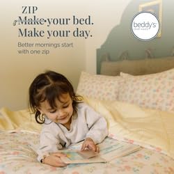 Child reading a book on a bed with bedding from Beddy's, featuring the brand logo.