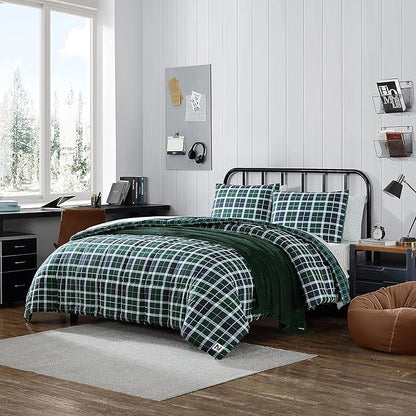 Bedroom with green plaid bedding, desk, and window.