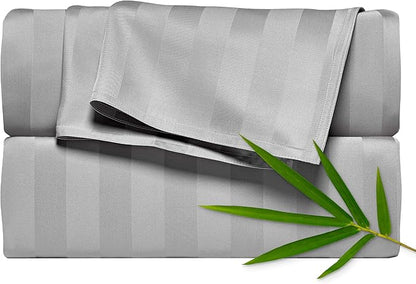 Gray striped fabric with a green leaf on a white background