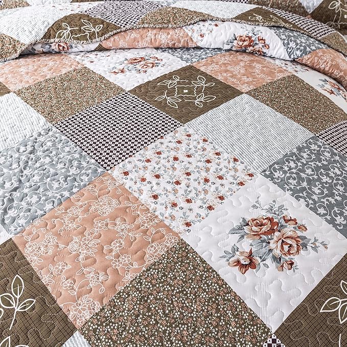Patchwork quilt with floral and geometric patterns in brown, white, and beige tones