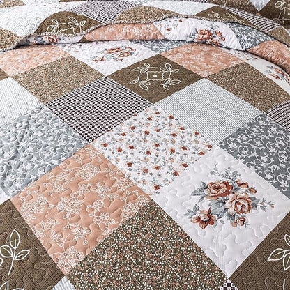 Patchwork quilt with floral and geometric patterns in brown, white, and beige tones