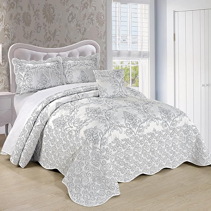 Bed with floral patterned bedding in a bedroom setting