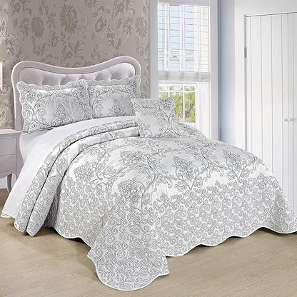 Bed with floral patterned bedding in a bedroom setting