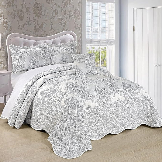 Bed with floral patterned bedding in a bedroom setting