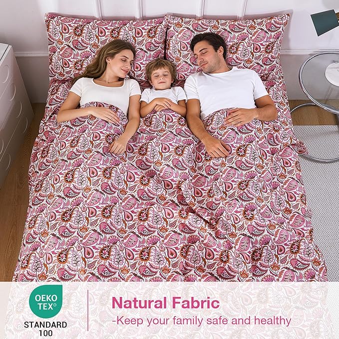 Family lying under a patterned duvet with Oeko-Tex certification label.