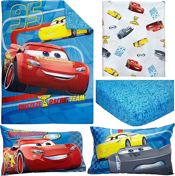 Collection of Disney Cars-themed bedding items including a comforter, sheet, and pillows.