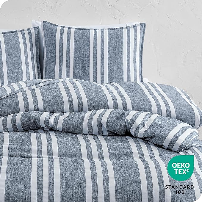 Striped bedding set with Oeko-Tex Standard 100 label on a light gray background