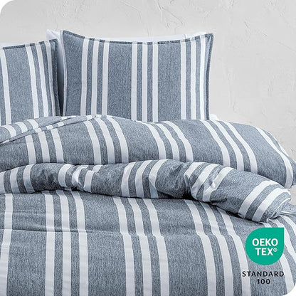 Striped bedding set with Oeko-Tex Standard 100 label on a light gray background