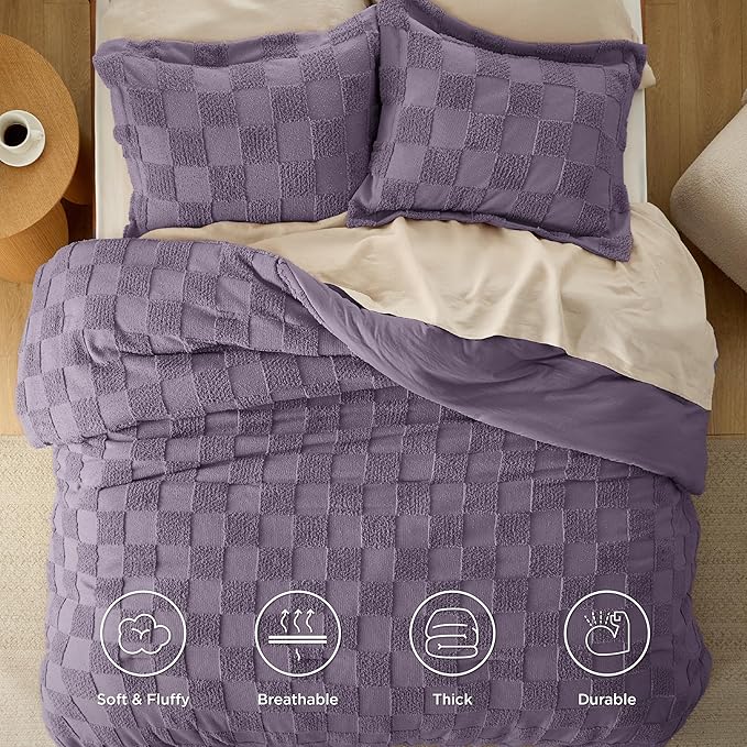 Purple checkered comforter set on a bed with visible features like soft, fluffy, breathable, thick, and durable.