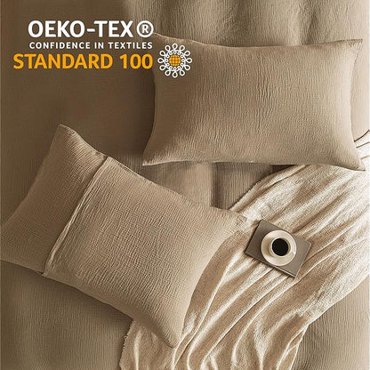 Beige textured fabric with pillows and a button, featuring Oeko-Tex Standard 100 logo.