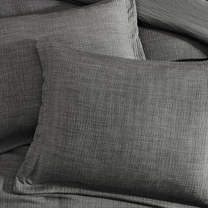 Gray textured pillow on a gray sofa